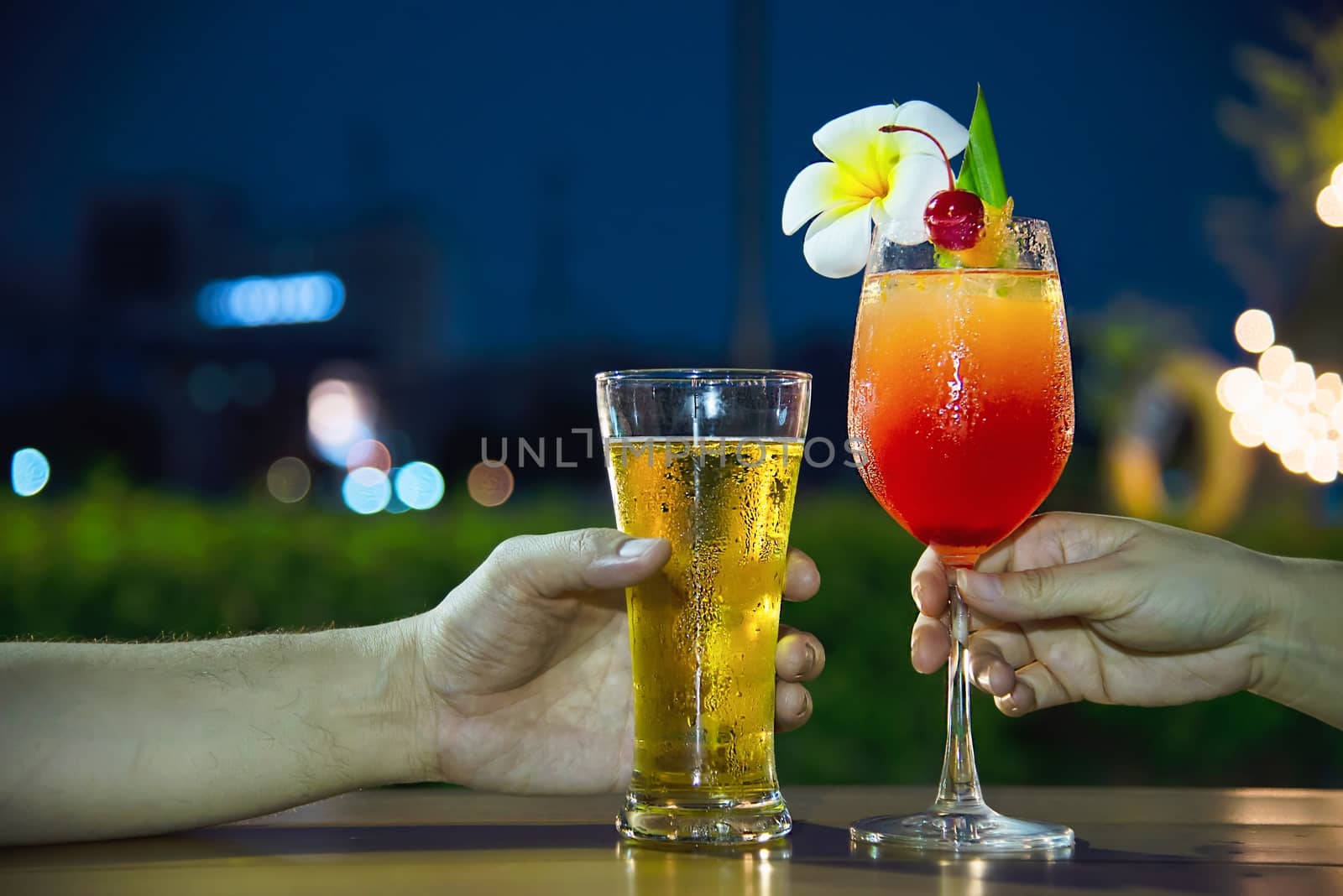 Couple celebration in restaurant with soft drink beer and mai tai or mai thai by pairhandmade