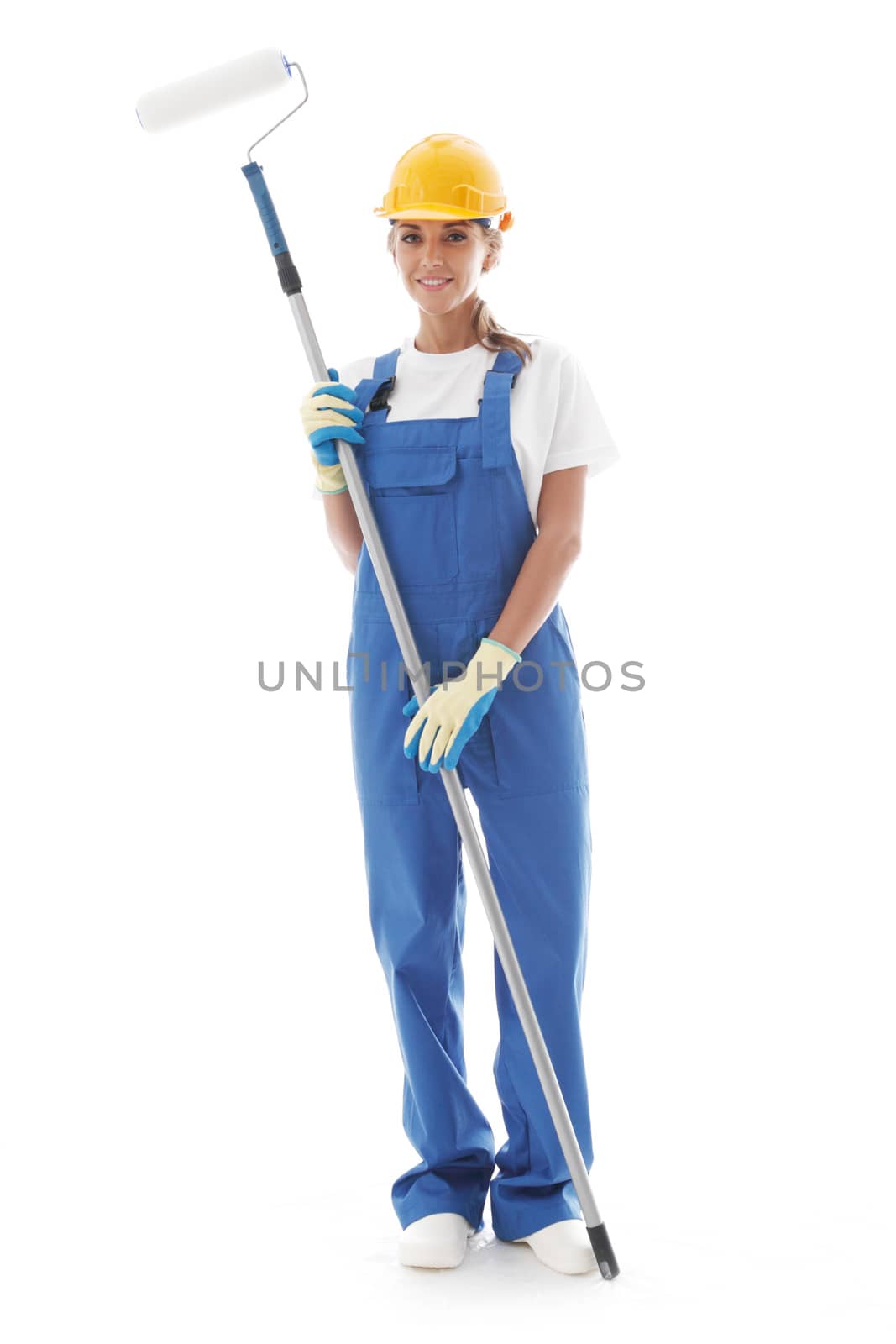 Young beautiful handywoman with paint roller isolated on white