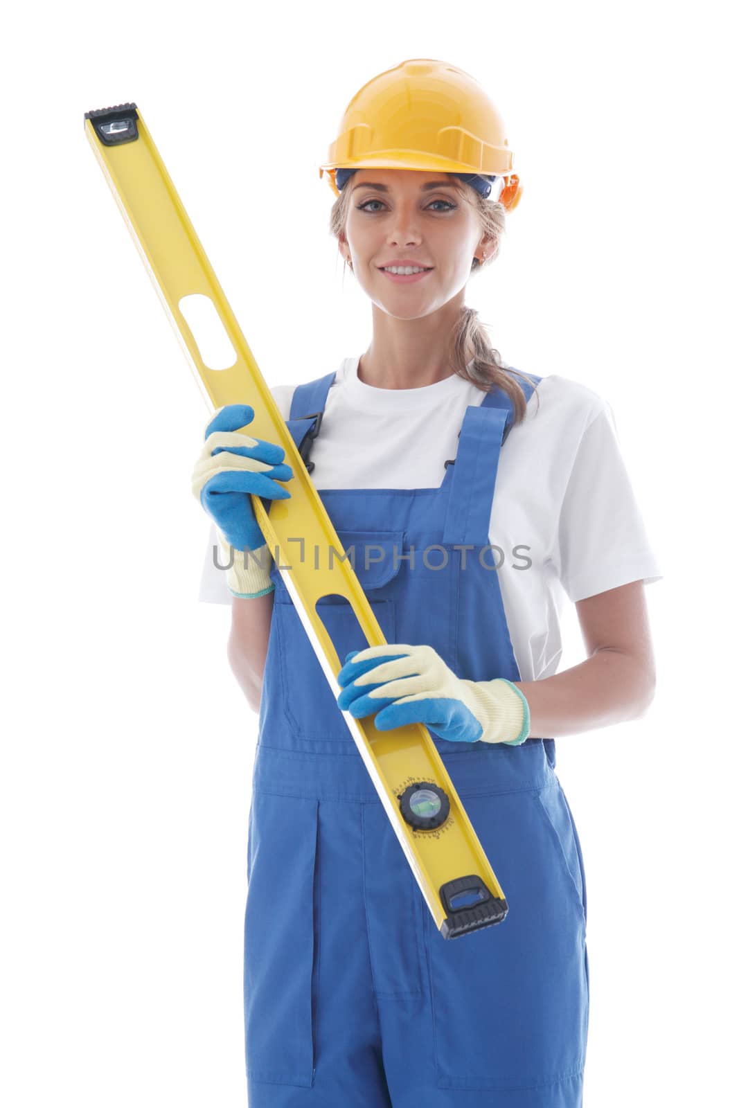 Young beautiful handywoman with building level isolated on white