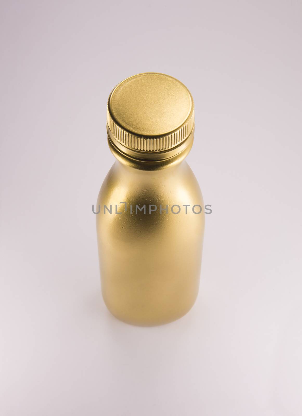 Gold plastic bottle. Clean pattern for packaging design