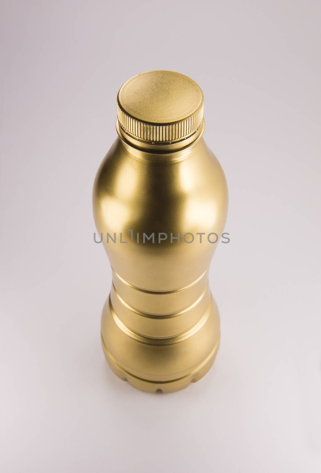 Gold plastic bottle. Clean pattern for packaging design