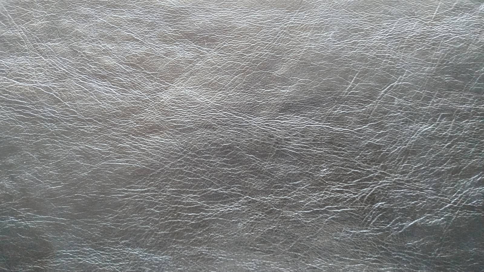 Dark gray genuine leather. Background, texture. Close up shot. by alexey_zheltukhin