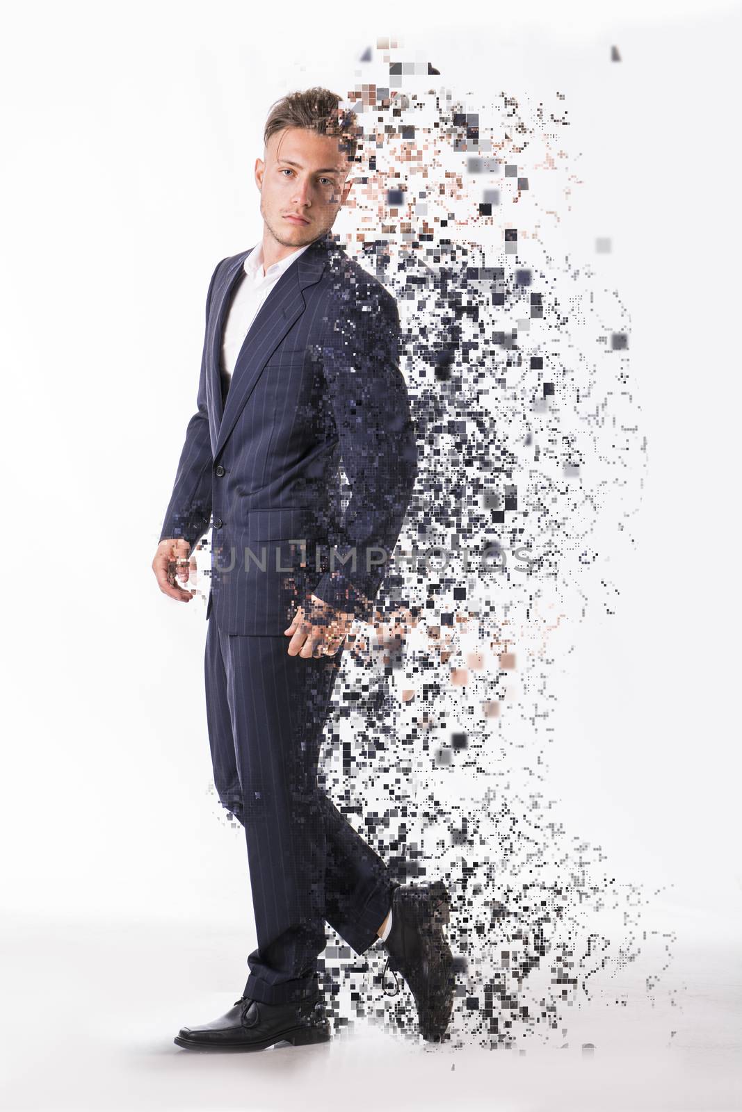 Side view of handsome serious man wearing modern suit in effect of diffusion with fractals on white background