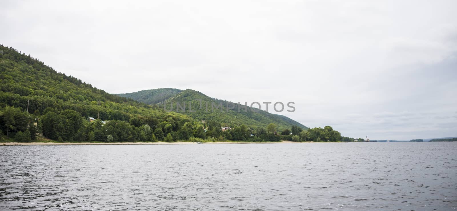 View of the Zhiguli mountains in the Samara region, Russia. Cloudy day, August 10, 2018 by butenkow