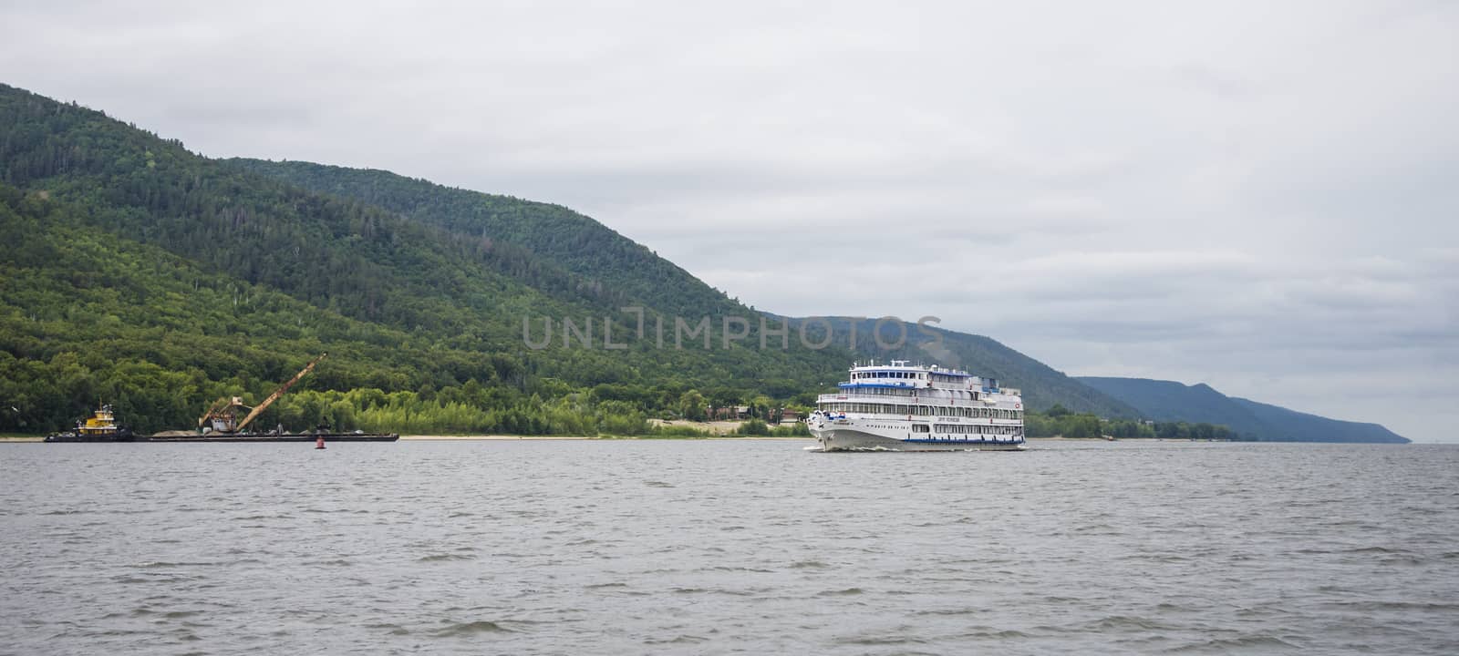 View of the Zhiguli mountains in the Samara region, Russia. Cloudy day, August 10, 2018 by butenkow