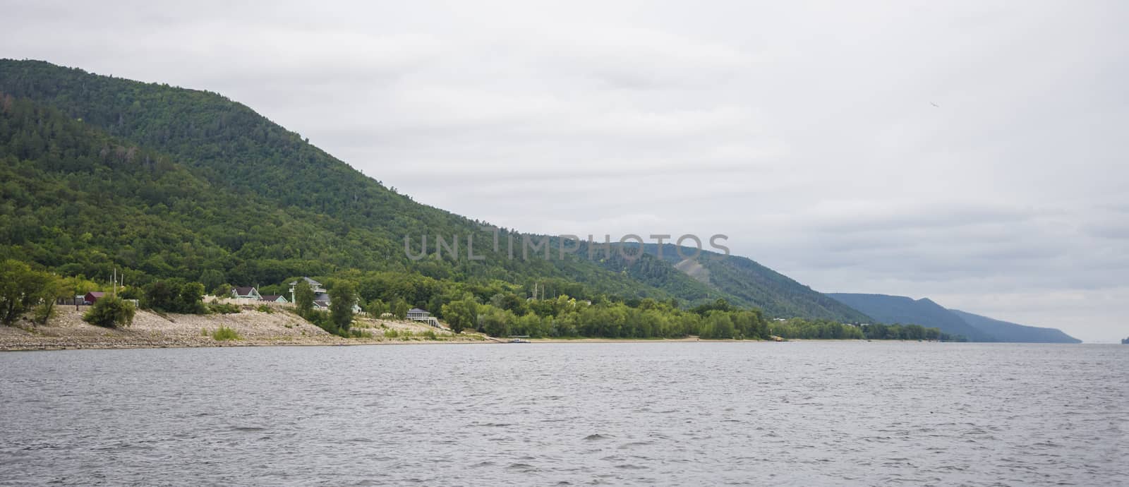 View of the Zhiguli mountains in the Samara region, Russia. Cloudy day, August 10, 2018 by butenkow