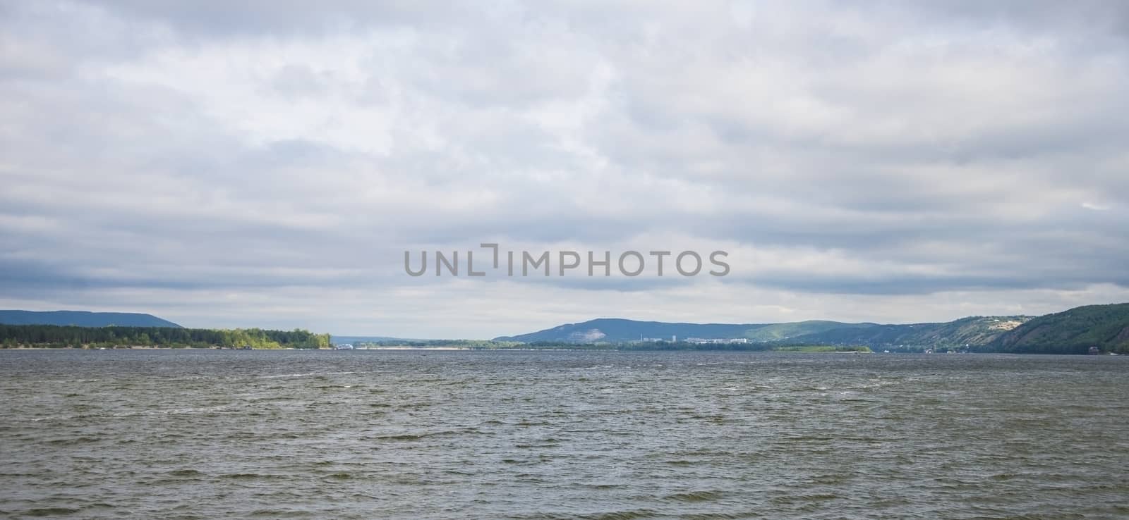 View of the Zhiguli mountains in the Samara region, Russia. Cloudy day, August 10, 2018 by butenkow