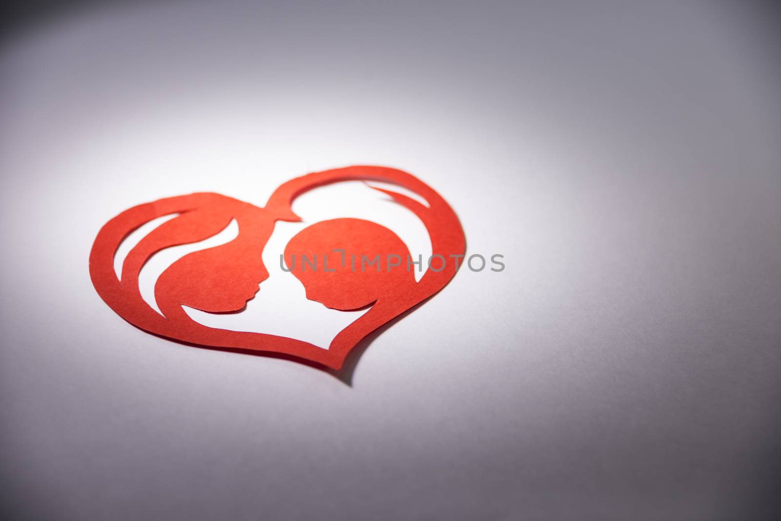 mother and child in the form of hearts from paper.