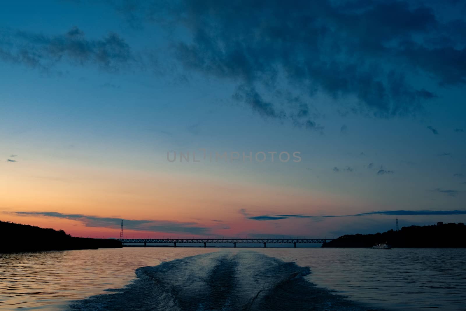 Splashes of water from the boat at sunset. by rdv27