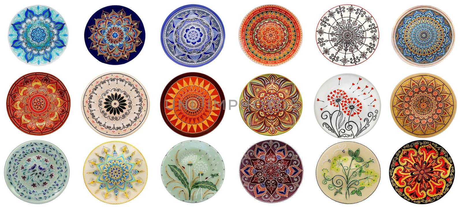 Set of decorative ceramic dishes hand-painted with acrylic paints floral pattern isolated on white background.