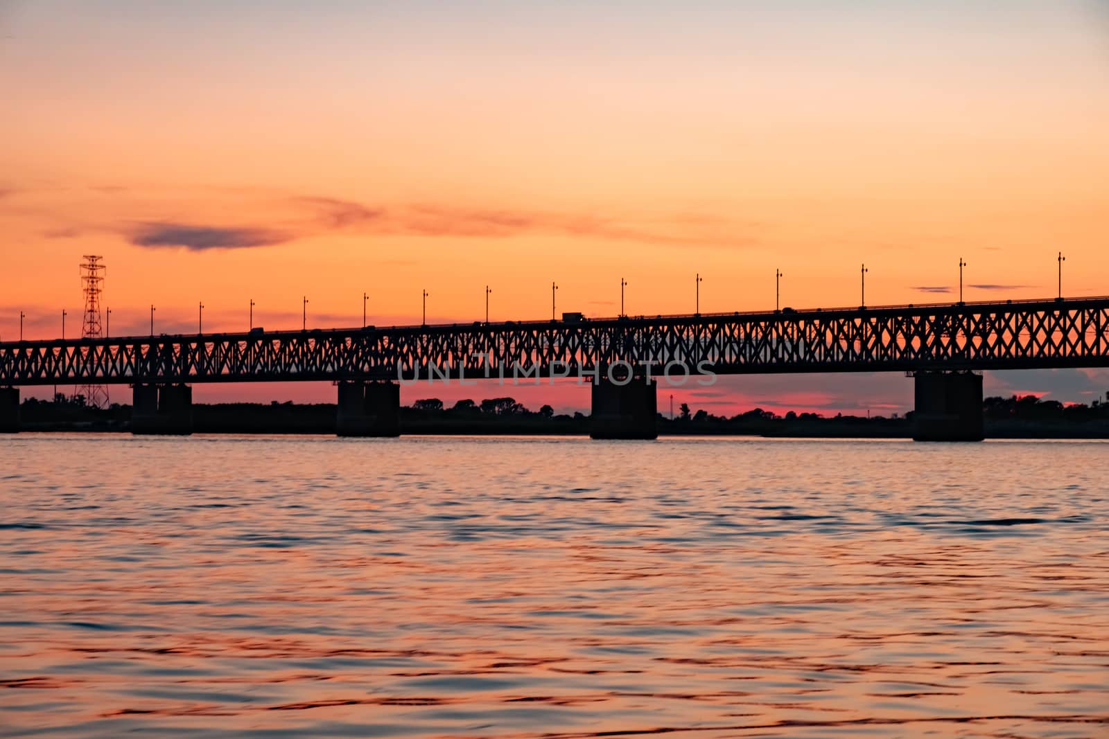 Bridge over the Amur river at sunset. Russia. Khabarovsk. Photo from the middle of the river