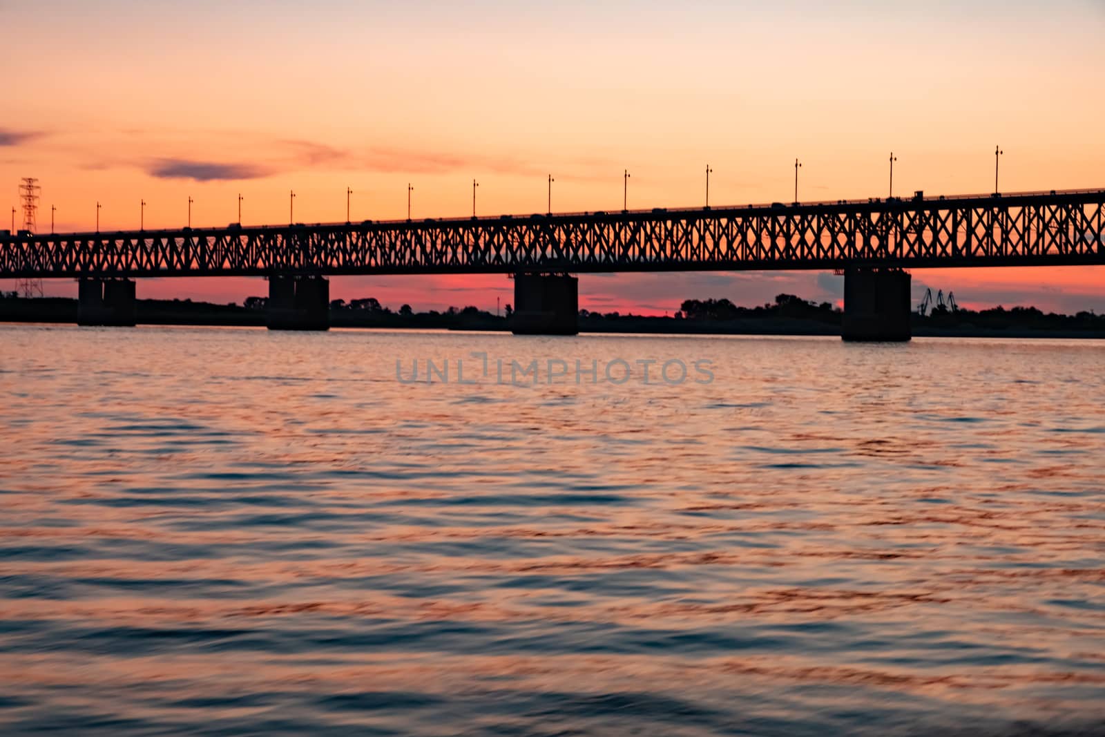 Bridge over the Amur river at sunset. Russia. Khabarovsk. Photo from the middle of the river. by rdv27