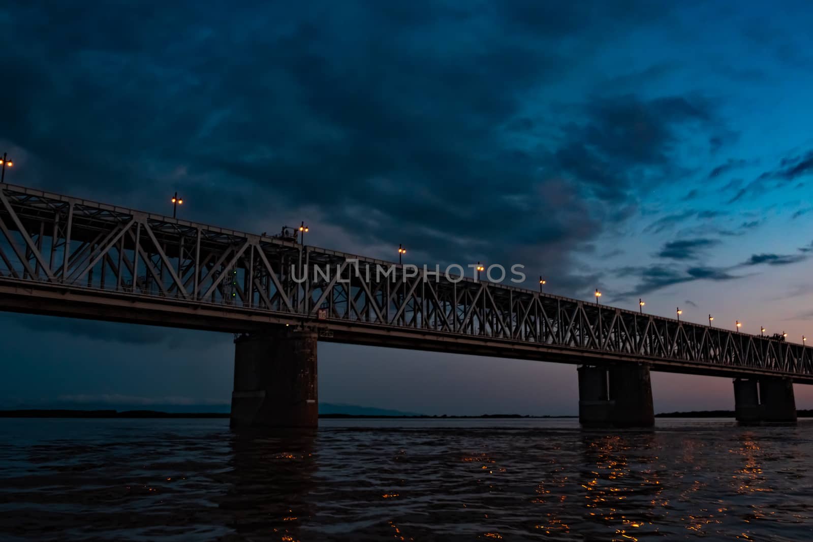 Bridge over the Amur river at sunset. Russia. Khabarovsk. Photo from the middle of the river. by rdv27