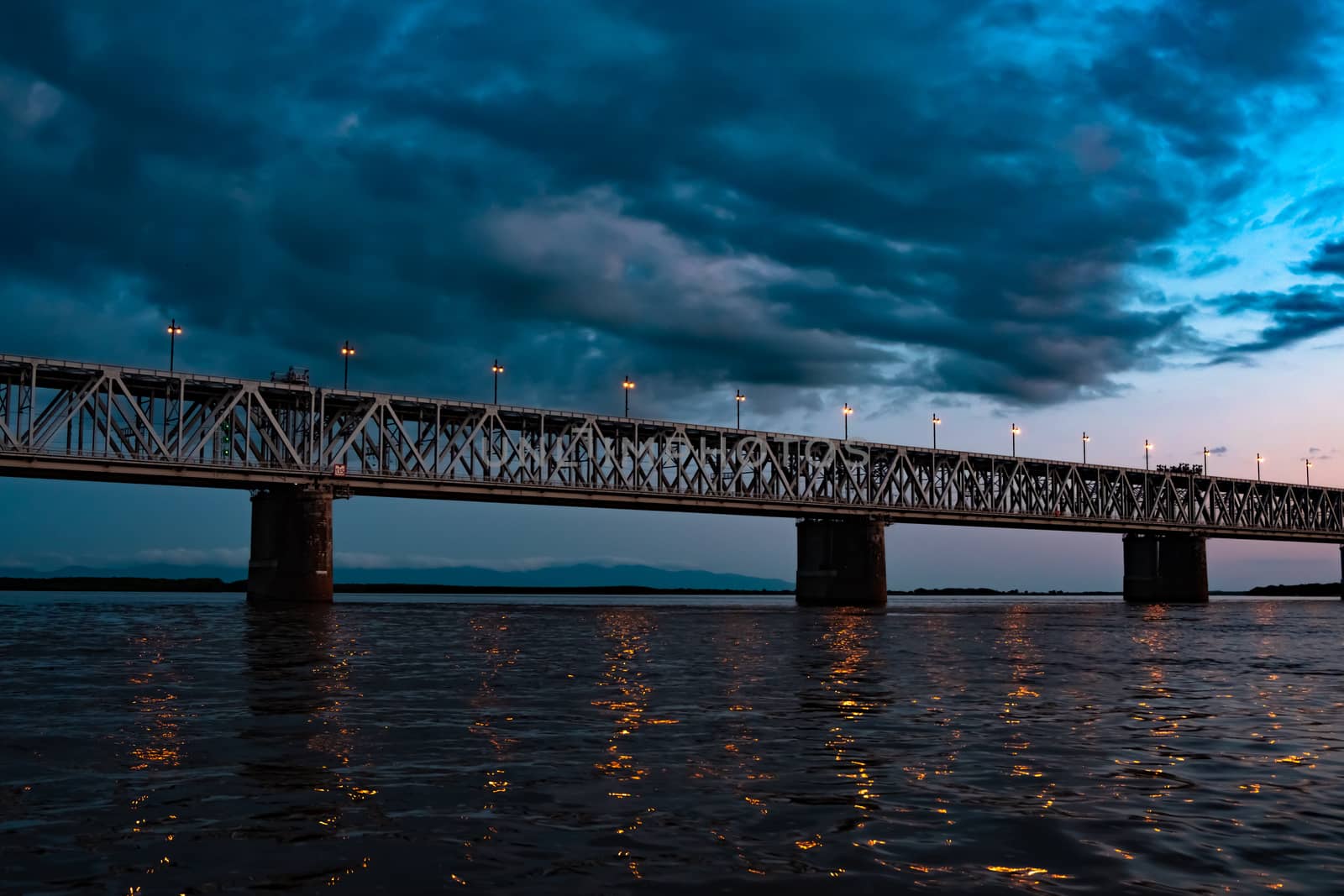 Bridge over the Amur river at sunset. Russia. Khabarovsk. Photo from the middle of the river