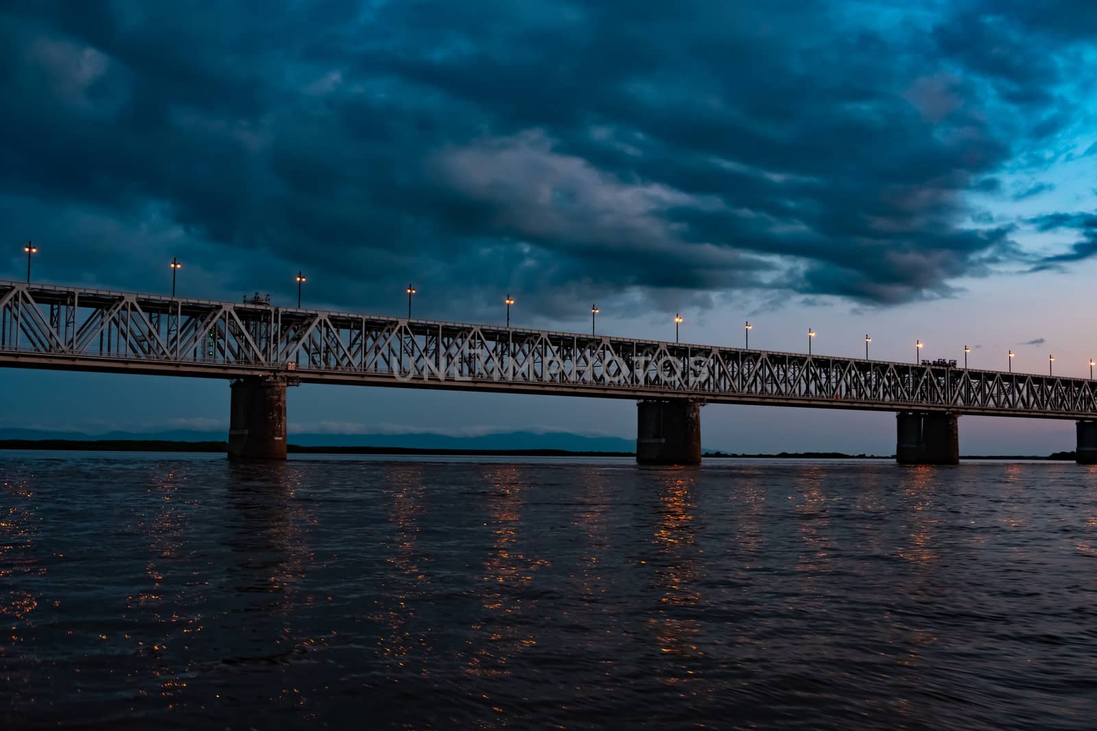 Bridge over the Amur river at sunset. Russia. Khabarovsk. Photo from the middle of the river. by rdv27