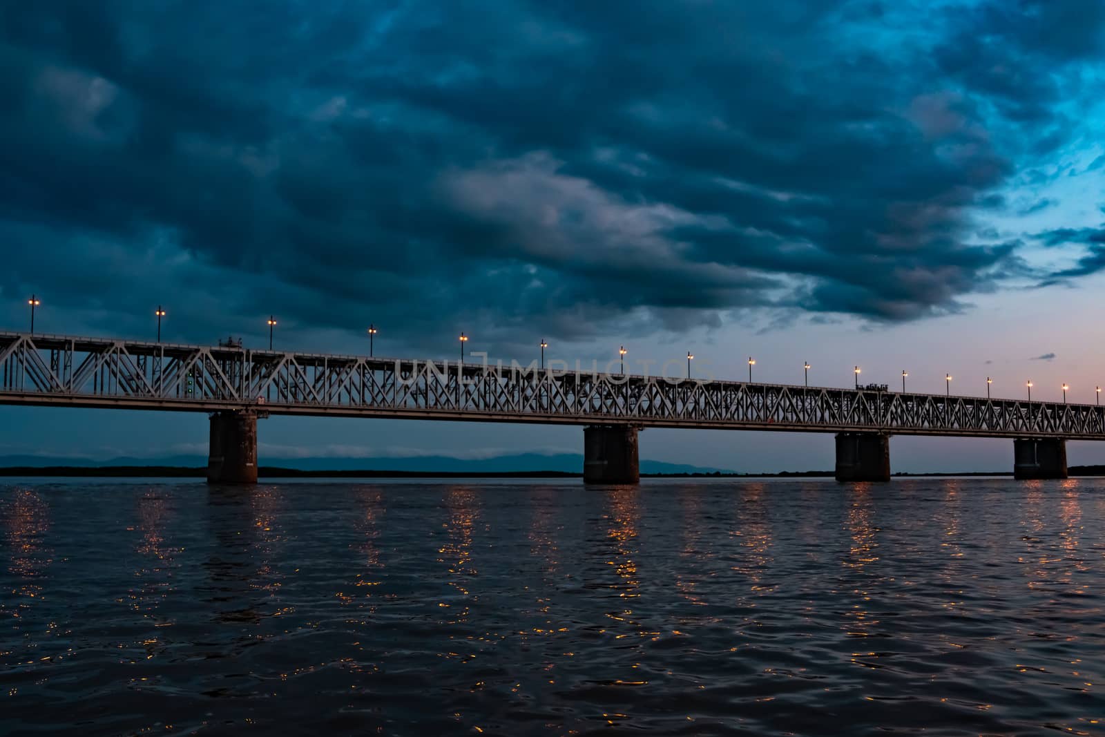 Bridge over the Amur river at sunset. Russia. Khabarovsk. Photo from the middle of the river