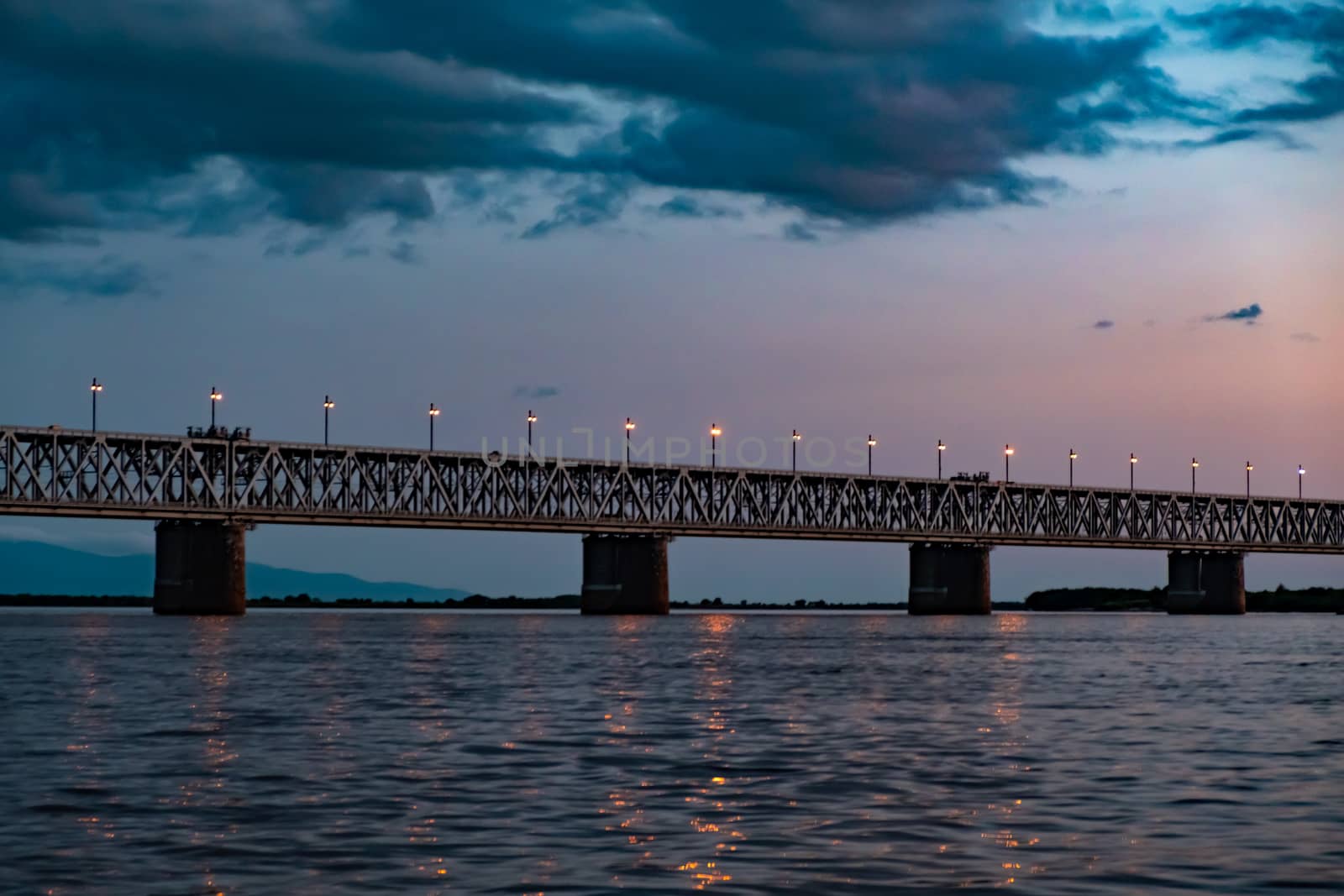 Bridge over the Amur river at sunset. Russia. Khabarovsk. Photo from the middle of the river