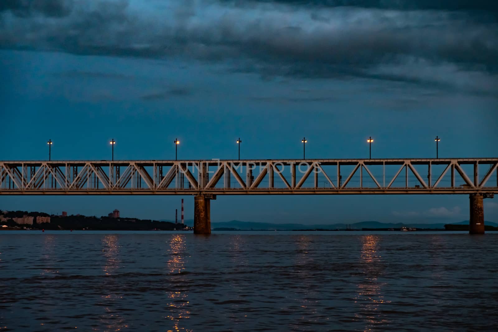 Bridge over the Amur river at sunset. Russia. Khabarovsk. Photo from the middle of the river. by rdv27