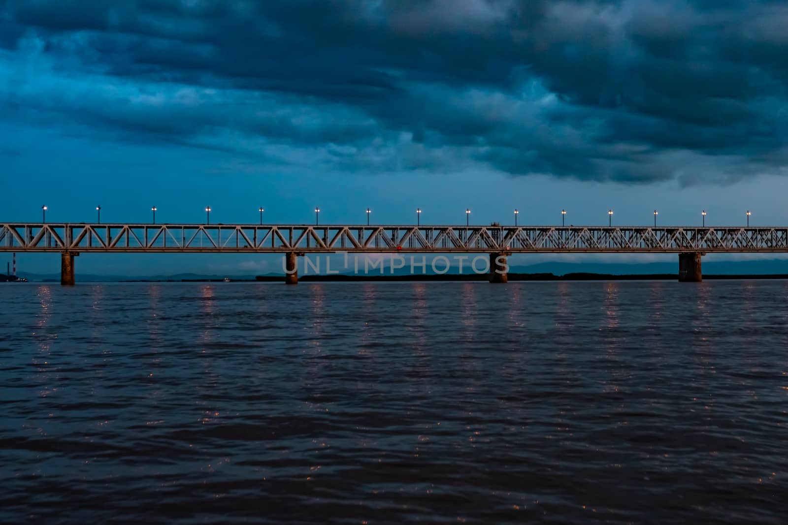 Bridge over the Amur river at sunset. Russia. Khabarovsk. Photo from the middle of the river