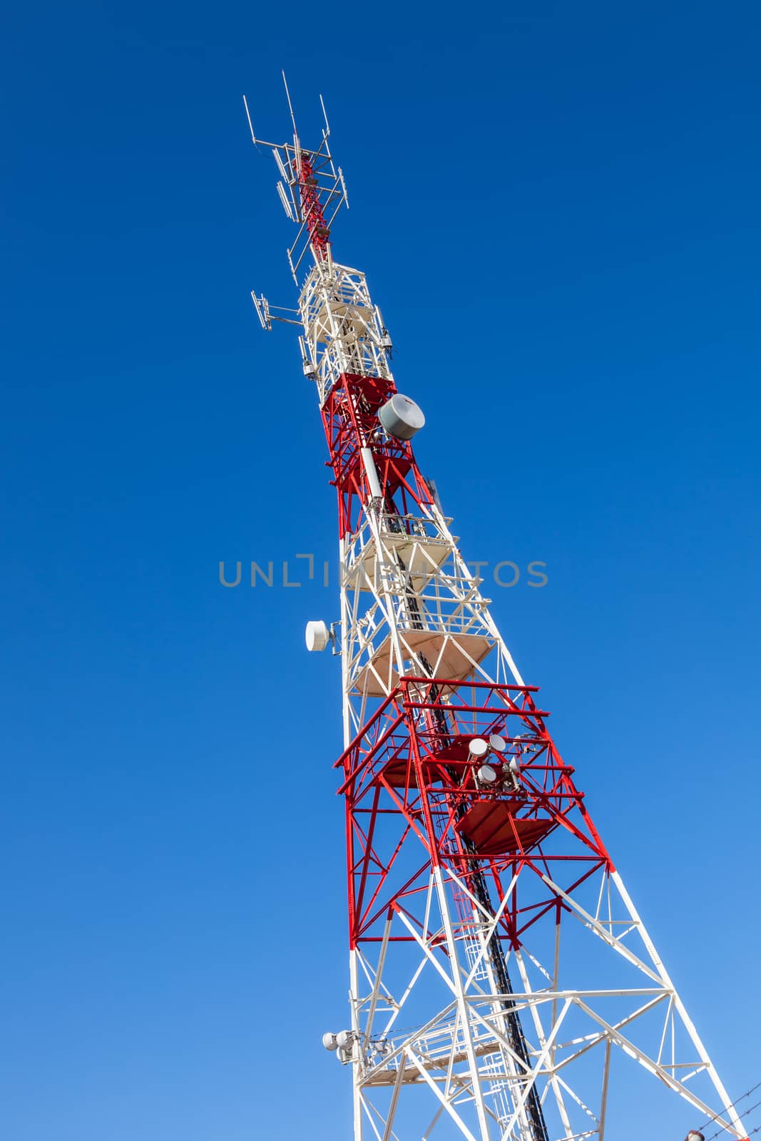 Communications tower with a beautiful blue sky on Puerto Real, Cadiz, Spain