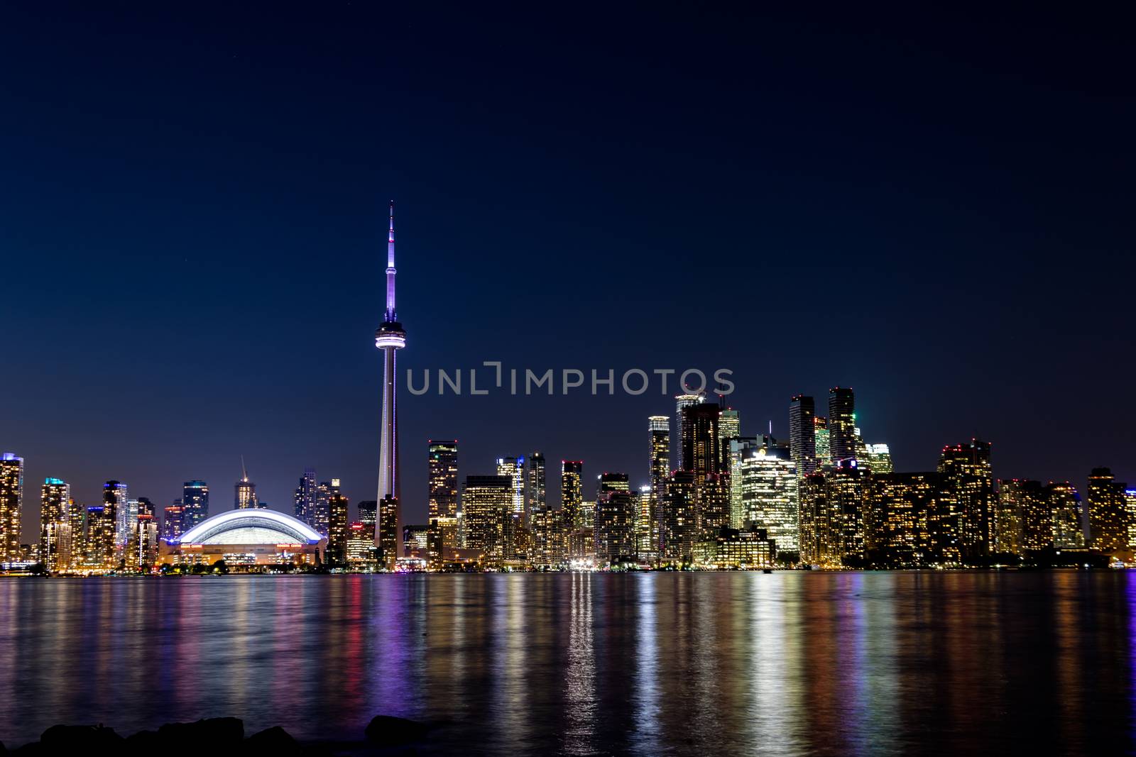 Night View of Downtown Toronto from Toronto Islands with the Lake Ontario, Canada.
