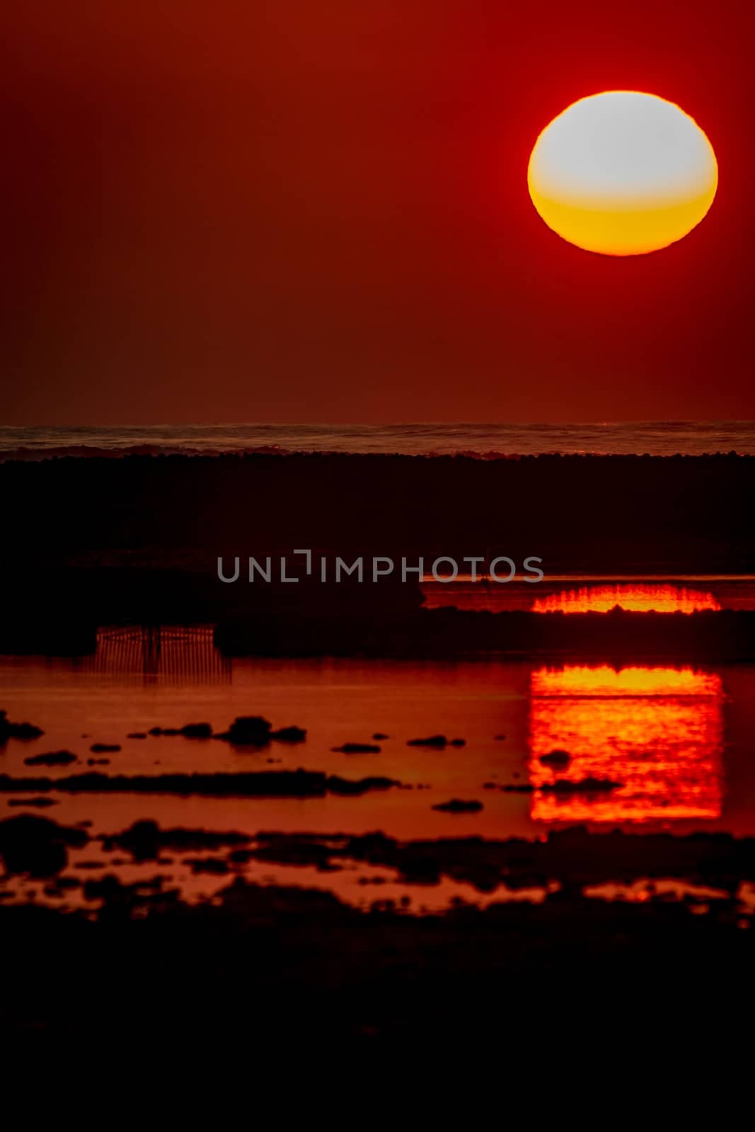Sunset on the beach of the Corrales, fish pens, of Rota, Cadiz, Spain