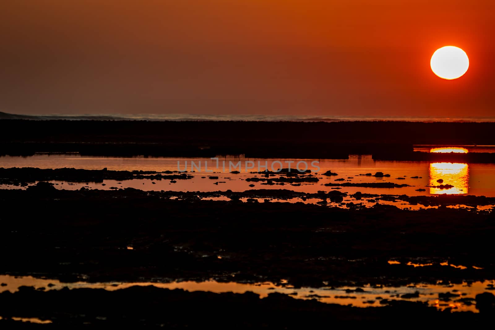 Sunset on the beach of the Corrales, fish pens, of Rota, Cadiz, Spain