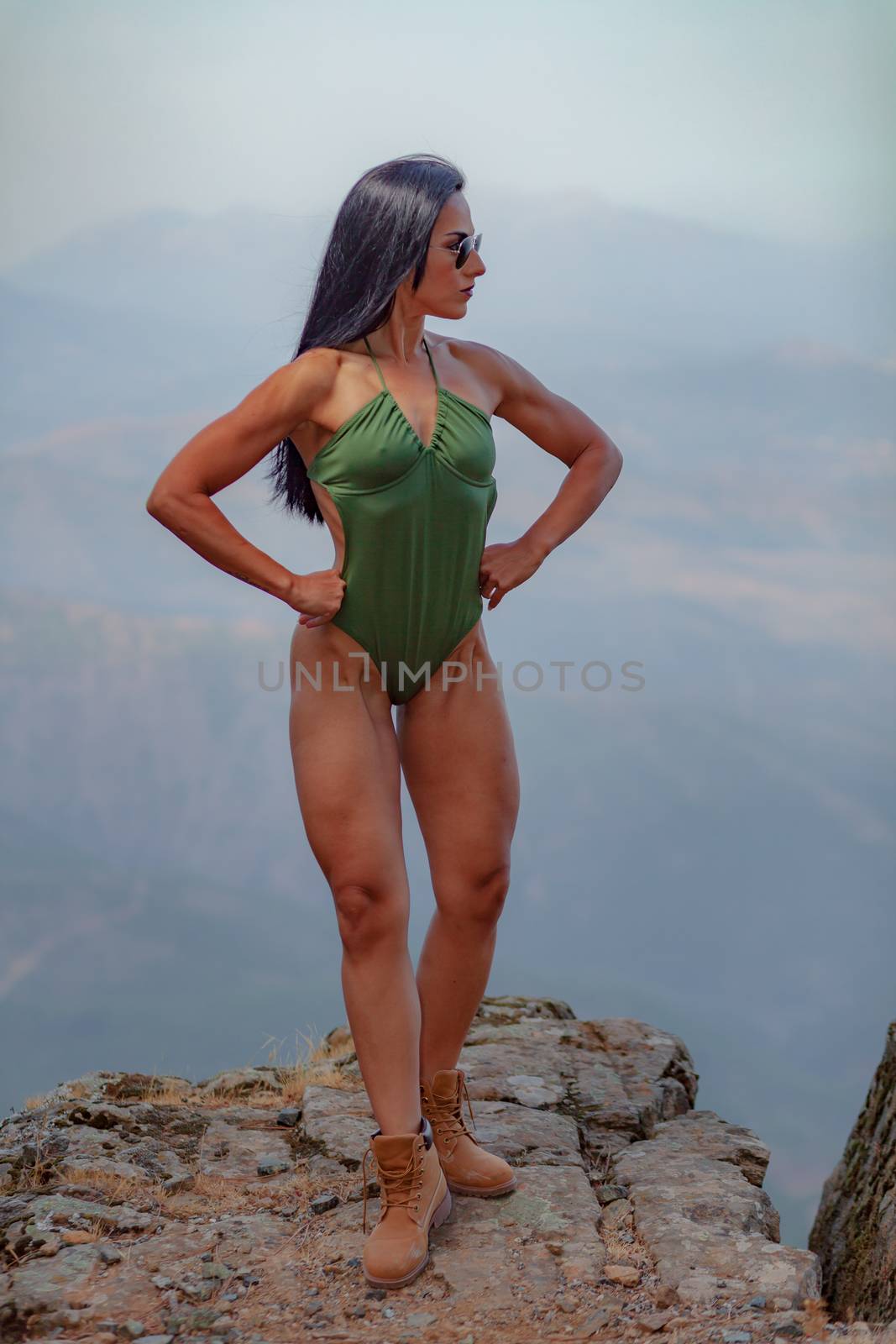 Fitness girl posing with a beautiful green 
swimsuit by viledevil