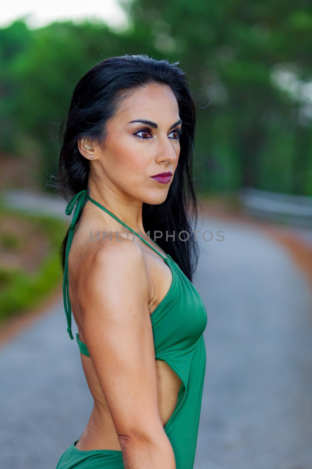 Fitness girl posing with a beautiful green 
swimsuit by viledevil