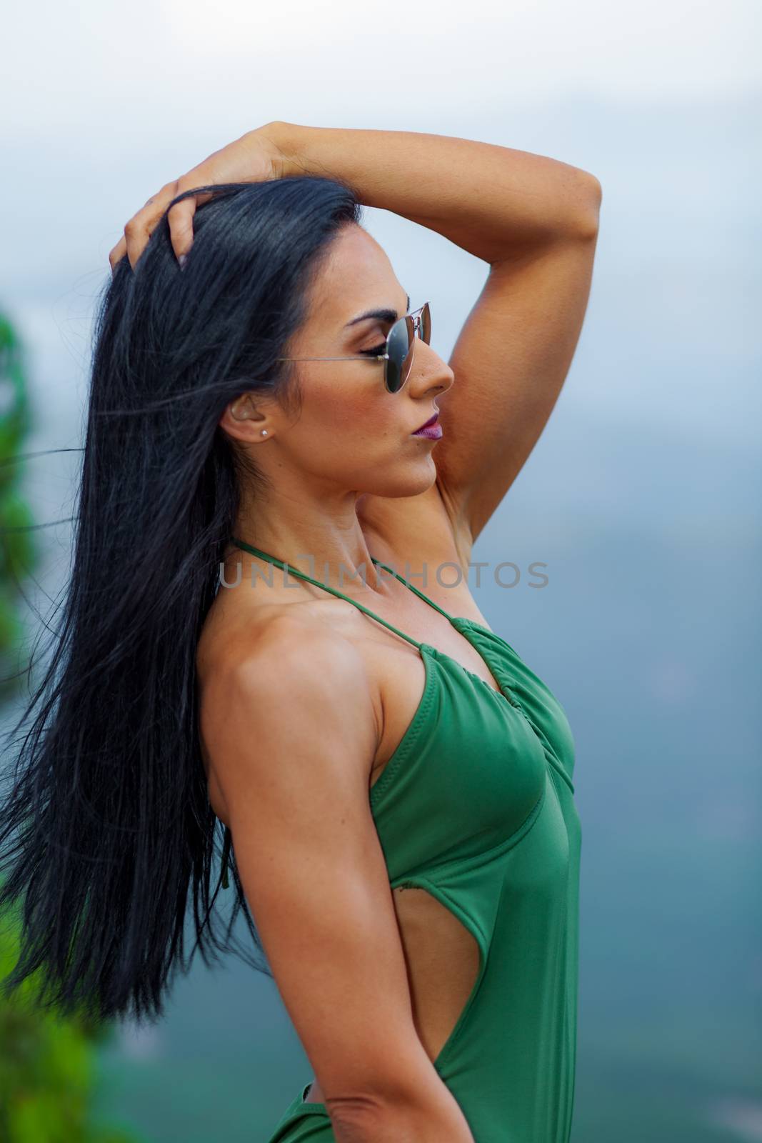 Fitness girl posing with a beautiful green 
swimsuit by viledevil