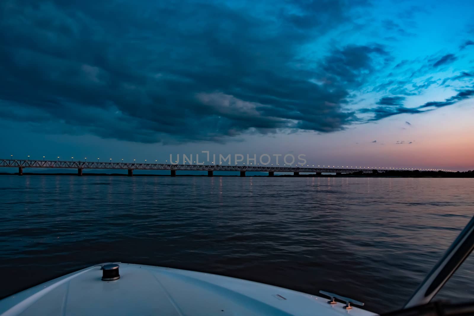 Bridge over the Amur river at sunset. Russia. Khabarovsk. Photo from the middle of the river