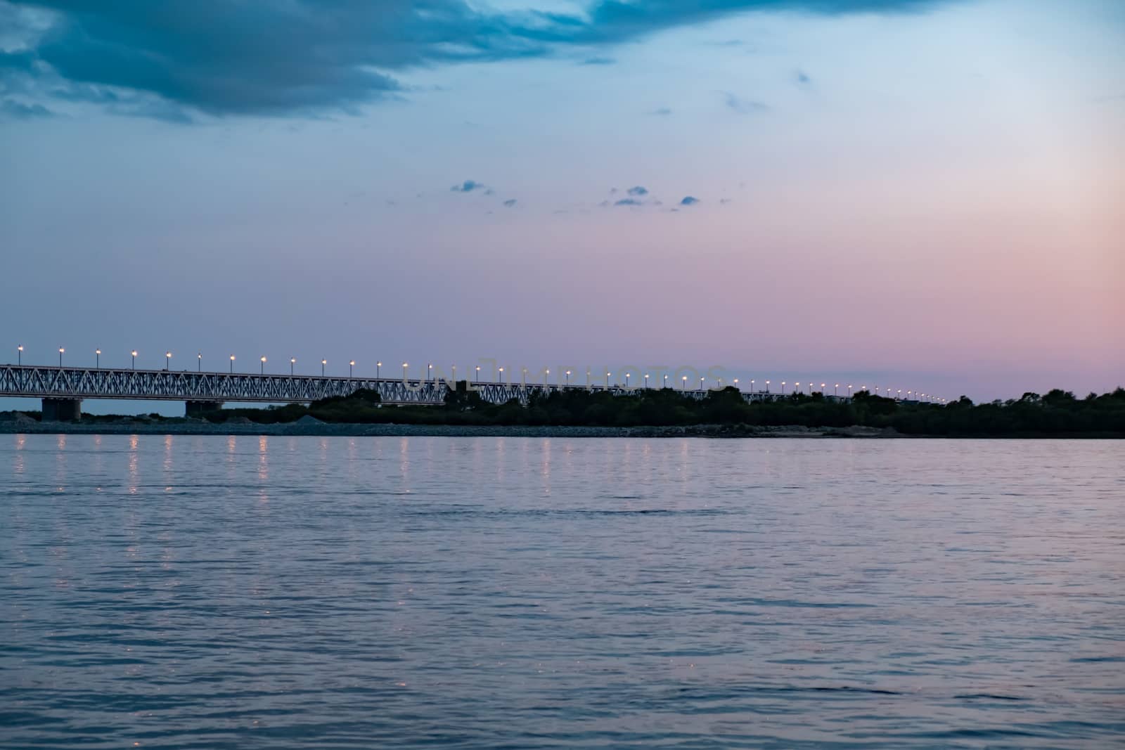 Bridge over the Amur river at sunset. Russia. Khabarovsk. Photo from the middle of the river. by rdv27