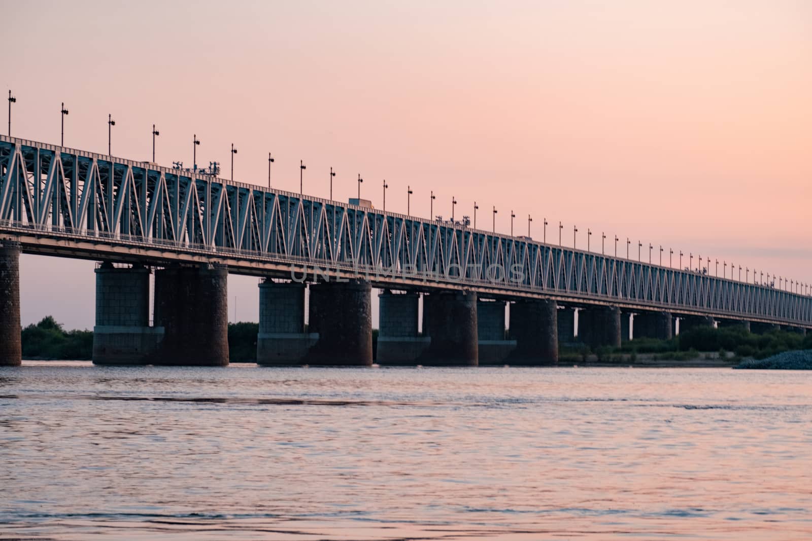 Bridge over the Amur river at sunset. Russia. Khabarovsk. Photo from the middle of the river