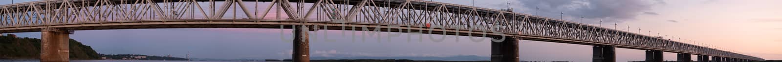 Bridge over the Amur river at sunset. Russia. Khabarovsk. Photo from the middle of the river. by rdv27