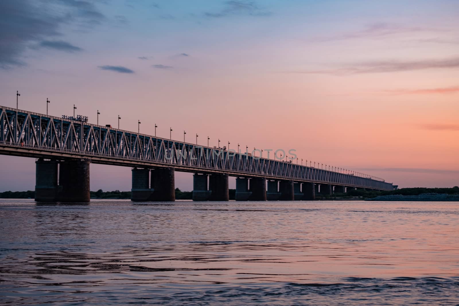 Bridge over the Amur river at sunset. Russia. Khabarovsk. Photo from the middle of the river