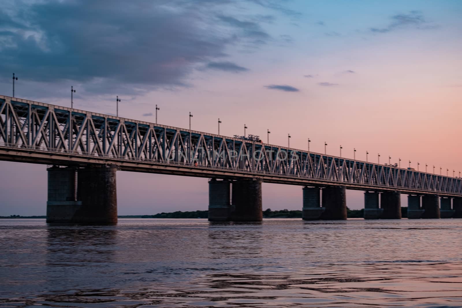 Bridge over the Amur river at sunset. Russia. Khabarovsk. Photo from the middle of the river