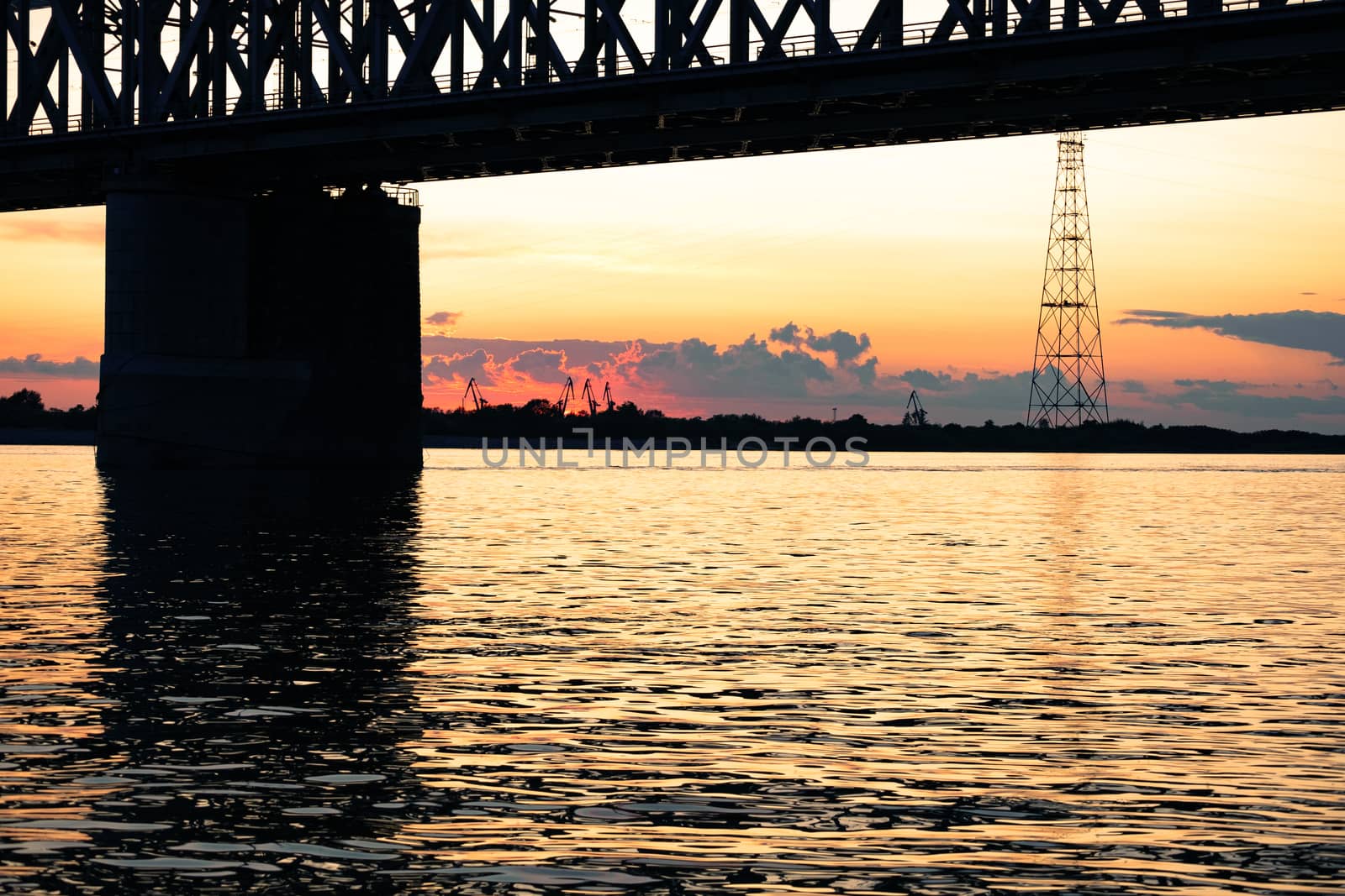 Bridge over the Amur river at sunset. Russia. Khabarovsk. Photo from the middle of the river