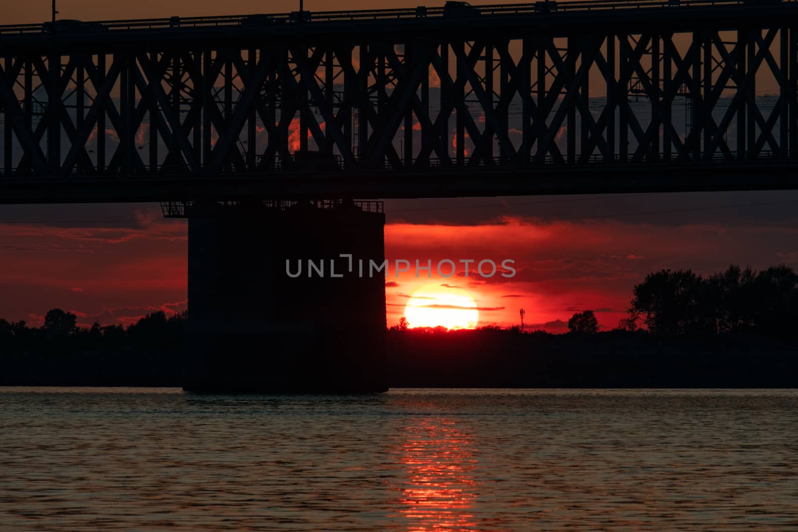 Bridge over the Amur river at sunset. Russia. Khabarovsk. Photo from the middle of the river