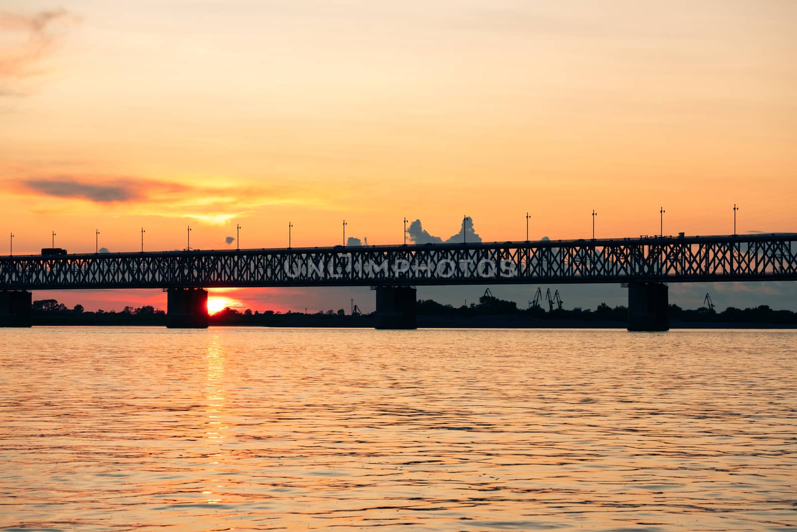 Bridge over the Amur river at sunset. Russia. Khabarovsk. Photo from the middle of the river