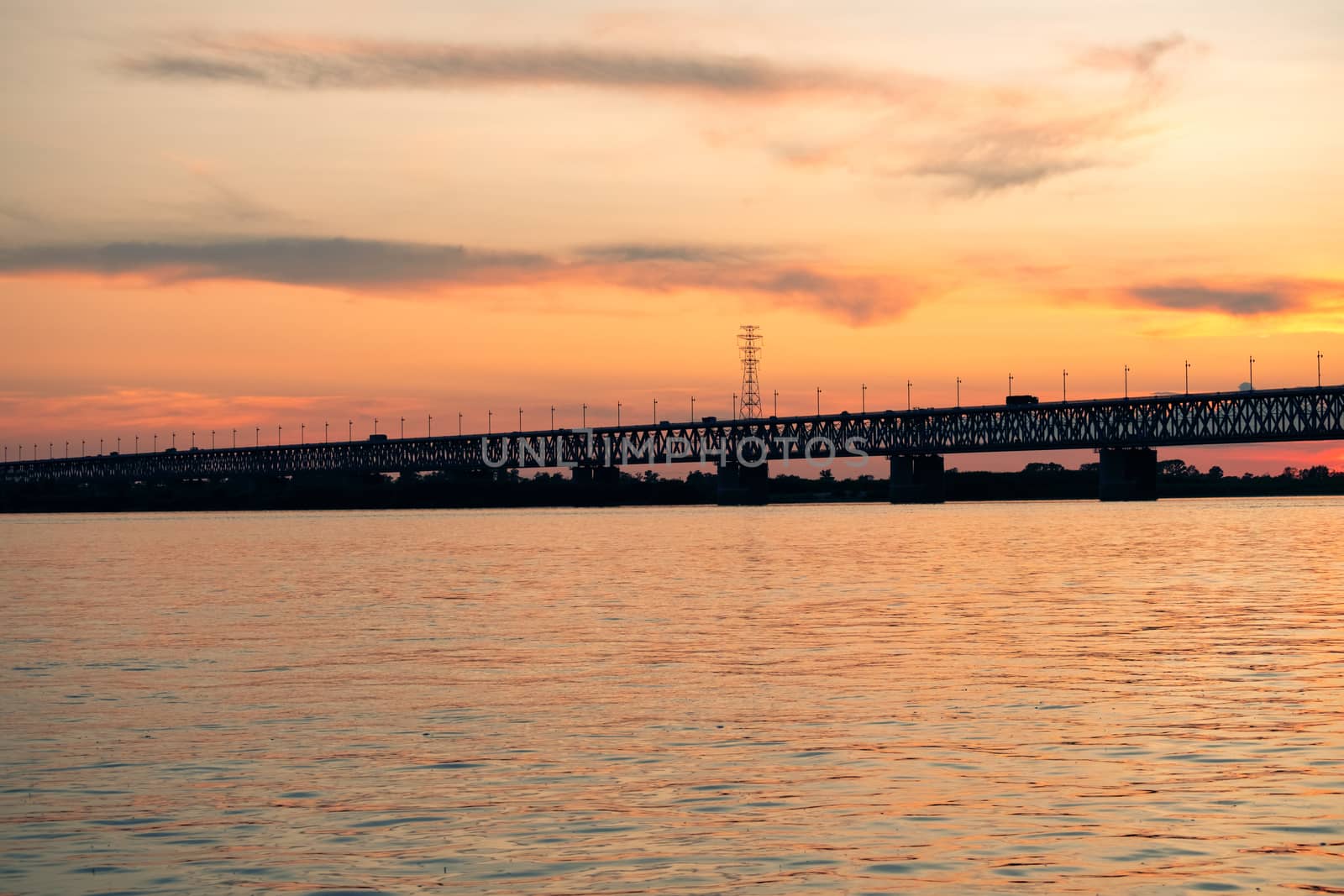 Bridge over the Amur river at sunset. Russia. Khabarovsk. Photo from the middle of the river