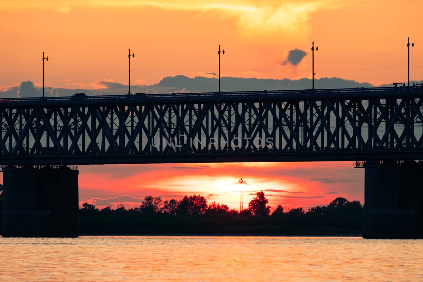 Bridge over the Amur river at sunset. Russia. Khabarovsk. Photo from the middle of the river