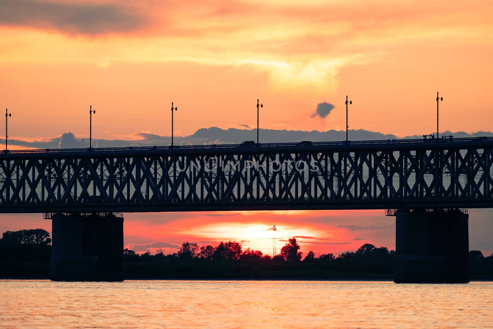 Bridge over the Amur river at sunset. Russia. Khabarovsk. Photo from the middle of the river