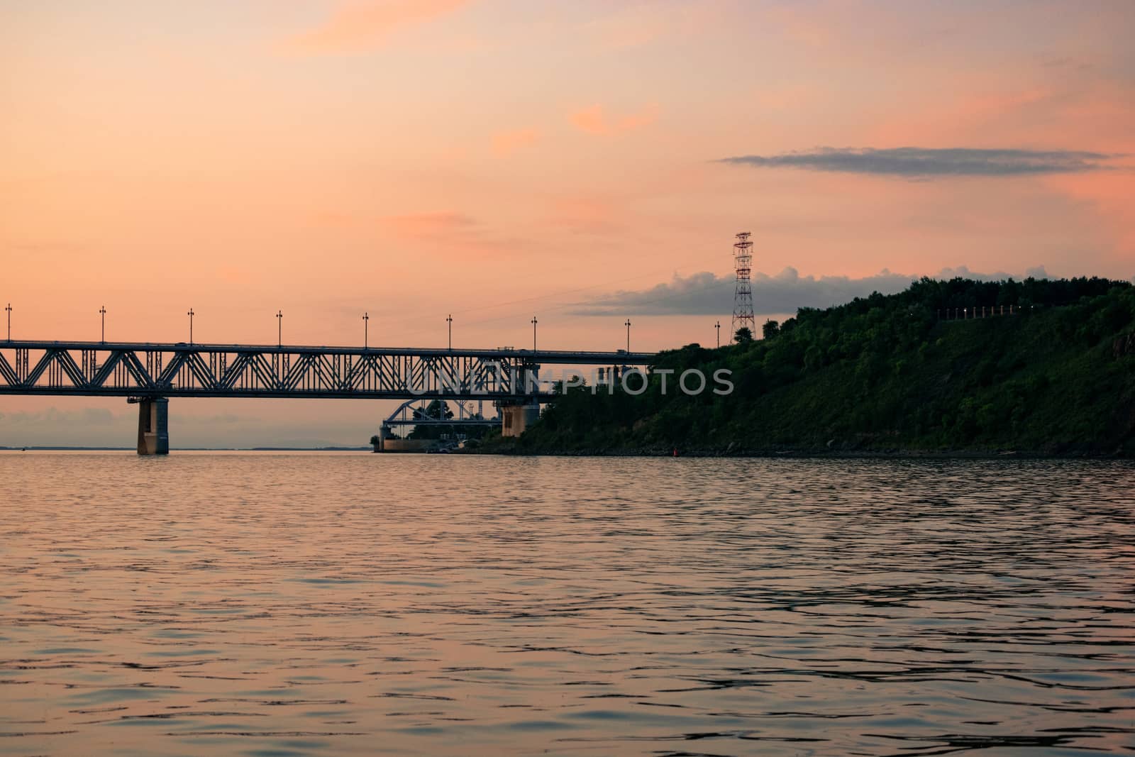 Bridge over the Amur river at sunset. Russia. Khabarovsk. Photo from the middle of the river