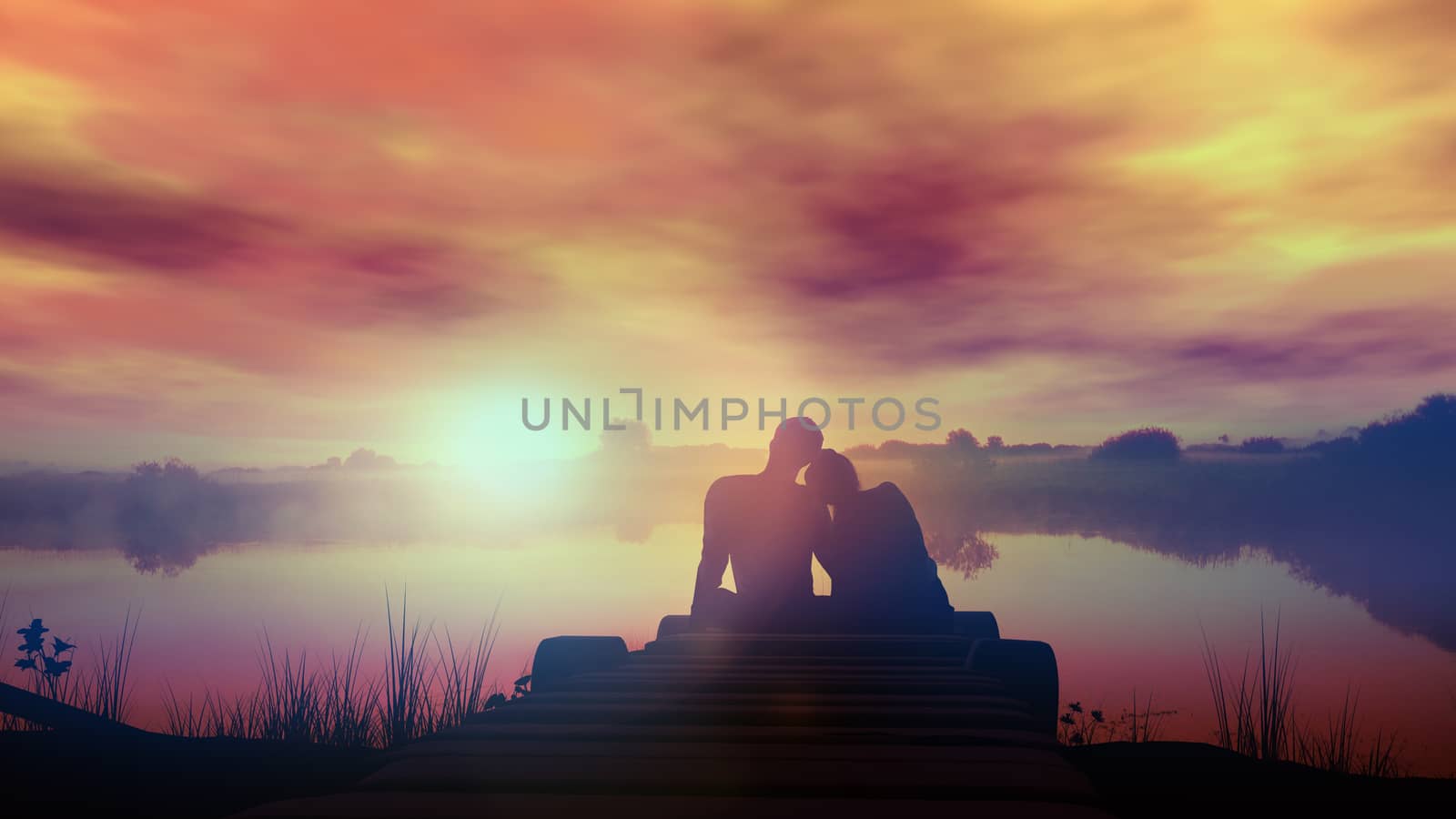 A loving couple is sitting on the wooden pier in front of the lake at sunset.