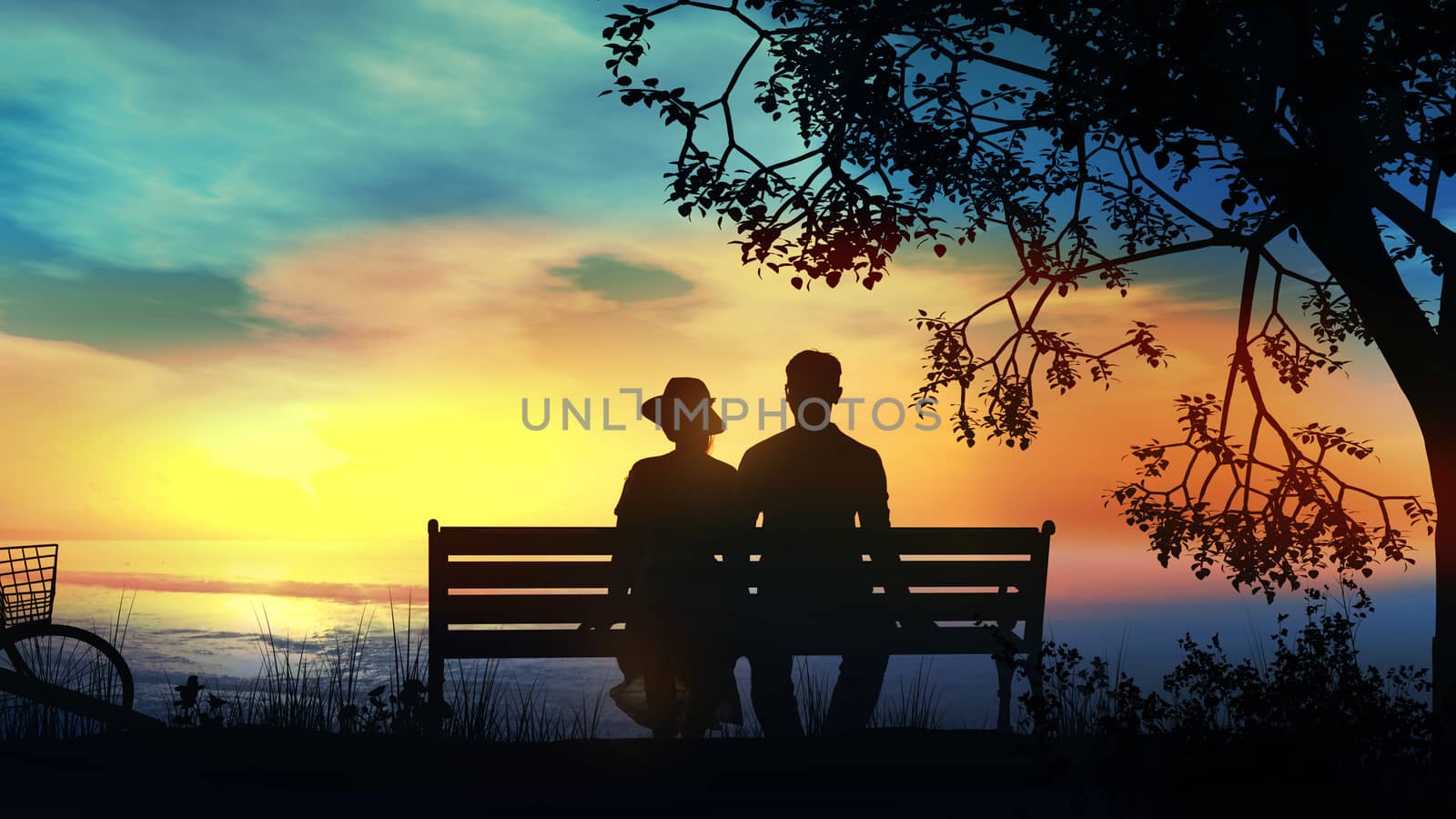 Silhouettes of a couple sitting on a bench and watching the ocean sunset.