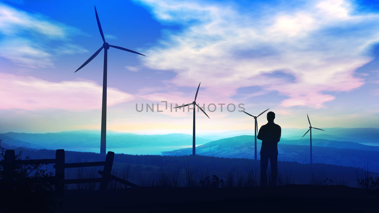 Silhouettes of a man and of wind power plants against the background of the cloudy sky.