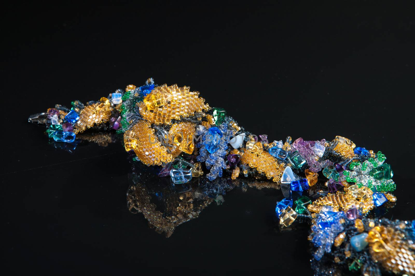 Different jewelries on a glass studio background