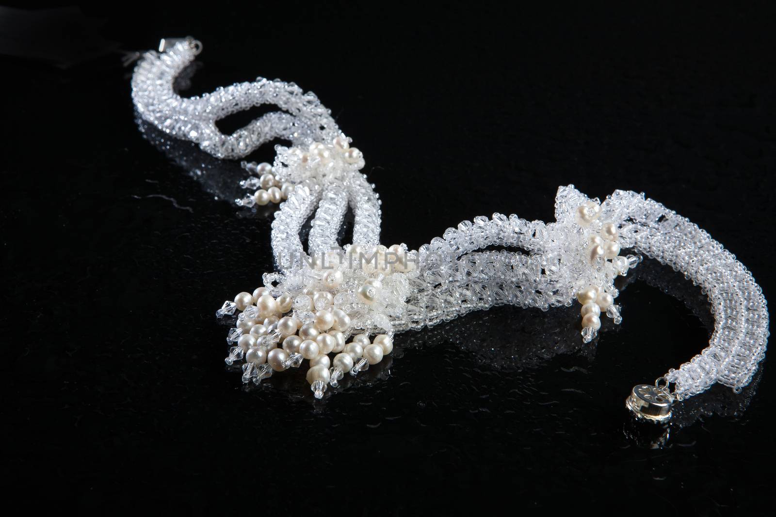 Different jewelries on a glass studio background