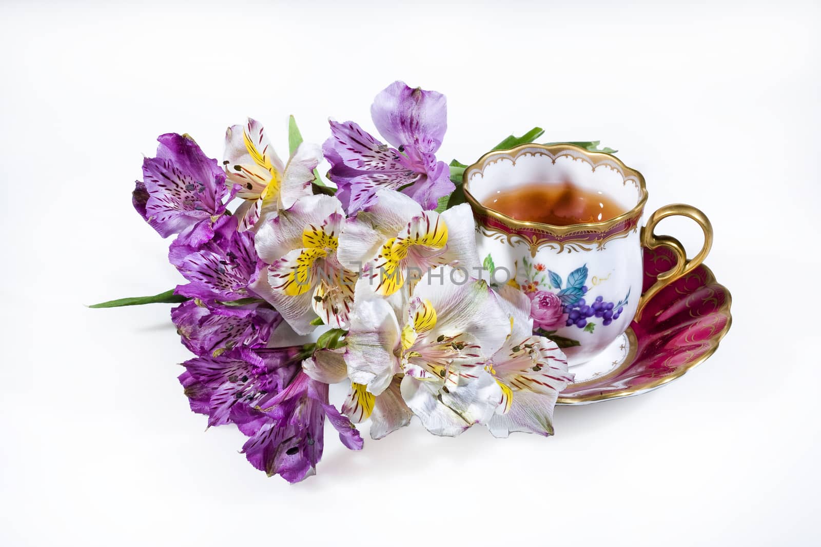 Cup of tea and bouquet of flowers