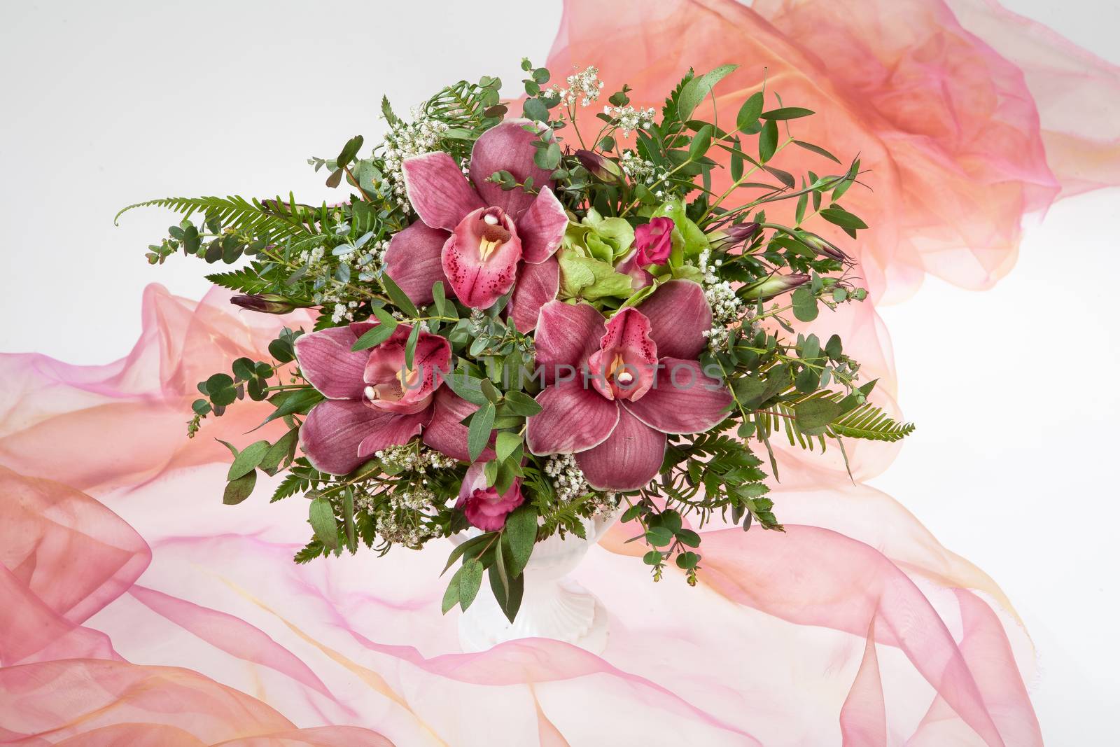 Bouquet of flowers on a fabric studio background